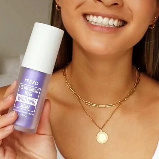 Woman holding ITZZO Purple Teeth Whitening Serum bottle